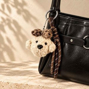 Shop the cute plush puppy keychain and bag charm at Glow Bagh. A soft, handmade braided rope pendant perfect for decorating your handbags and keys in BD.